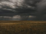 Dramatic storm clouds over grassland in Wagon Mound, New Mexico, USA.