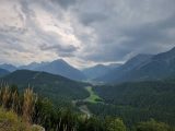 a view of a valley with mountains in the background