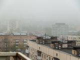 A view of a city in the fog