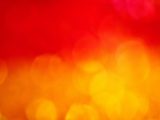 a blurry image of a red and yellow background