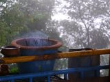 a pot sitting on top of a blue rail