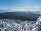 a view of the mountains covered in snow