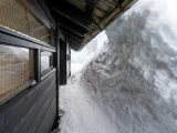 A view of a snow covered building from the outside