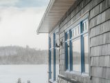 a house with a lake in the background