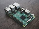 Detailed view of a Raspberry Pi circuit board with microchips and components.