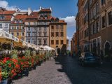 a city street lined with lots of flowers