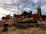a construction site with a crane in the background
