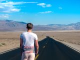 man standing in the middle of the road