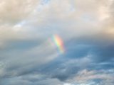 A colorful rainbow appears amid the clouds over Veracruz, Mexico.