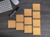 yellow sticky notes beside white apple magic mouse and white apple keyboard