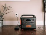 a black and silver radio on a wooden table