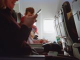 People traveling on an airplane during daytime.
