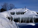 A house is covered in ice and snow