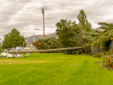 Fallen trees and electric poles after a storm in Hyrum, Utah field.