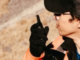 Close-up of a man using a walkie talkie outdoors. Perfect for security and communication themes.