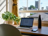 macbook pro on brown wooden table