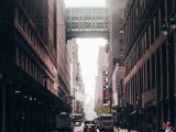 concrete road at middle of high rise buildings