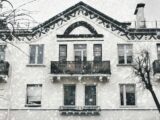 A building facade with windows and a balcony
