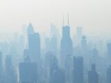 aerial view of high-rise buildings covered with smoke